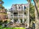 Charming three-story home with a spacious outdoor patio and balcony on each level, perfect for entertaining at 3215 N Pennsylvania St, Indianapolis, IN 46205