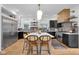 Bright kitchen featuring stainless steel appliances, large island and stylish light fixtures at 3215 N Pennsylvania St, Indianapolis, IN 46205
