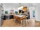 Modern kitchen with a large island, sleek black cabinetry, and stylish pendant lighting at 3215 N Pennsylvania St, Indianapolis, IN 46205
