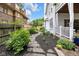 Beautifully landscaped side yard with stone pathway and mature plantings at 3215 N Pennsylvania St, Indianapolis, IN 46205