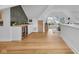 Open-concept living space with wet bar area featuring a wine fridge and decorative tile backsplash at 3215 N Pennsylvania St, Indianapolis, IN 46205
