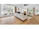 Sun-drenched living room features a cozy window seat, hardwood floors, fireplace and modern decor for a warm ambiance at 3215 N Pennsylvania St, Indianapolis, IN 46205