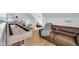Spacious game room features a shuffleboard table and a comfortable couch, perfect for entertaining guests at 3215 N Pennsylvania St, Indianapolis, IN 46205