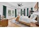 Spacious main bedroom with a ceiling fan and balcony access at 3215 N Pennsylvania St, Indianapolis, IN 46205