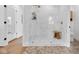 Luxurious marble shower with glass enclosure and seating at 3215 N Pennsylvania St, Indianapolis, IN 46205