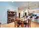 Spacious dining room with hardwood floors, modern lighting, and open access to the kitchen at 350 N Meridian St # A303, Indianapolis, IN 46204