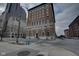 View of a grand building exterior on a city corner with crosswalks and street lights at 350 N Meridian St # A303, Indianapolis, IN 46204