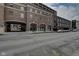 Exterior street view of brick buildings showing an archway and various windows at 350 N Meridian St # A303, Indianapolis, IN 46204