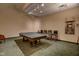 Spacious game room features a ping pong table, cue rack, and comfortable seating at 350 N Meridian St # A303, Indianapolis, IN 46204