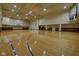 Spacious gymnasium with polished hardwood floor and basketball hoops at 350 N Meridian St # A303, Indianapolis, IN 46204