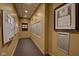 Hallway featuring a bulletin board, mailboxes, and framed community information at 350 N Meridian St # A303, Indianapolis, IN 46204