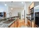Beautiful kitchen with stainless steel appliances, open layout, flows to dining room at 350 N Meridian St # A303, Indianapolis, IN 46204