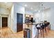 A well-designed kitchen with eat-in counter, stainless steel appliances and wood cabinets at 350 N Meridian St # A303, Indianapolis, IN 46204