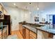 Well-appointed kitchen featuring stainless appliances, granite countertops, and wood cabinetry at 350 N Meridian St # A303, Indianapolis, IN 46204