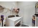 Functional laundry area with a modern washer and dryer set and wire shelving for storage solutions at 350 N Meridian St # A303, Indianapolis, IN 46204