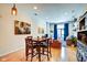 Spacious living area features hardwood floors, artwork, and natural light from a large window at 350 N Meridian St # A303, Indianapolis, IN 46204