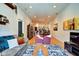 Open-concept living area featuring hardwood floors, comfortable seating, and a view of the kitchen at 350 N Meridian St # A303, Indianapolis, IN 46204