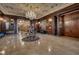 Ornate lobby with a crystal chandelier, marble floors, and wood paneling at 350 N Meridian St # A303, Indianapolis, IN 46204