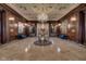 Ornate lobby with a crystal chandelier, marble floors, and wood paneling at 350 N Meridian St # A303, Indianapolis, IN 46204