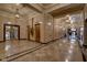 Elegant lobby area featuring marble floors and gold elevator doors at 350 N Meridian St # A303, Indianapolis, IN 46204