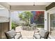 Cozy covered patio with comfortable seating and scenic backyard view at 3535 Clearwater Cir, Indianapolis, IN 46240
