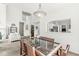 Open-concept dining area with a glass-top table, seamlessly connecting to the living space at 3535 Clearwater Cir, Indianapolis, IN 46240