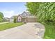 Charming two-story home with a brick facade, attached garage, and a curved driveway at 3535 Clearwater Cir, Indianapolis, IN 46240