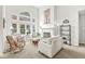 Airy living room featuring a fireplace, large windows, and stylish furnishings at 3535 Clearwater Cir, Indianapolis, IN 46240