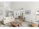 Open living space offering comfortable seating, natural light, and a view into the dining area at 3535 Clearwater Cir, Indianapolis, IN 46240