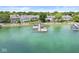 Waterfront property with a dock, boats and lush landscaping at 3535 Clearwater Cir, Indianapolis, IN 46240