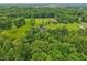 Overhead view of home, surrounded by trees, and long driveway leading to the property at 3564 Clear Creek Blvd, Martinsville, IN 46151