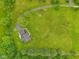 Beautiful aerial view of a home with a long driveway, lush green lawn, and mature trees at 3564 Clear Creek Blvd, Martinsville, IN 46151