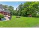 Expansive backyard with a picnic table and playset, ideal for outdoor enjoyment at 3564 Clear Creek Blvd, Martinsville, IN 46151