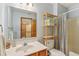 Stylish bathroom with a wood shelf, wood vanity with granite countertop, and decorative mirror at 3564 Clear Creek Blvd, Martinsville, IN 46151