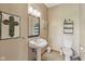 Cozy powder room features a pedestal sink and classic fixtures at 3564 Clear Creek Blvd, Martinsville, IN 46151