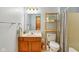 Charming bathroom with a wood shelf, wood vanity with granite countertop, and decorative mirror at 3564 Clear Creek Blvd, Martinsville, IN 46151