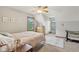 Inviting bedroom features a floral patterned bed under a ceiling fan at 3564 Clear Creek Blvd, Martinsville, IN 46151