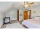 Light bedroom features a wood door, ceiling fan, and space for bed at 3564 Clear Creek Blvd, Martinsville, IN 46151