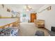 Spacious bedroom has a bunk bed, ceiling fan, and views from multiple windows at 3564 Clear Creek Blvd, Martinsville, IN 46151