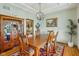 Formal dining room with hardwood floors, elegant lighting, and traditional decor at 3564 Clear Creek Blvd, Martinsville, IN 46151