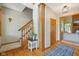 Foyer entrance with wood staircase, hardwood floors and blue rug at 3564 Clear Creek Blvd, Martinsville, IN 46151