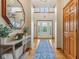 Inviting foyer with hardwood floors and a decorative mirror at 3564 Clear Creek Blvd, Martinsville, IN 46151