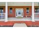 Covered front porch with white columns and a bench at 3564 Clear Creek Blvd, Martinsville, IN 46151