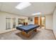 A carpeted game room provides the perfect space for a billiards table and entertainment at 3564 Clear Creek Blvd, Martinsville, IN 46151