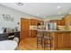 Charming kitchen featuring stainless steel appliances, granite countertops, and a breakfast bar with seating at 3564 Clear Creek Blvd, Martinsville, IN 46151