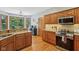 Traditional-style kitchen with wood cabinets, stainless steel appliances, and granite countertops at 3564 Clear Creek Blvd, Martinsville, IN 46151