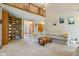 Open living room with high ceilings, bookshelves, and comfortable seating at 3564 Clear Creek Blvd, Martinsville, IN 46151