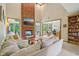 Bright living room with brick fireplace and open floor plan at 3564 Clear Creek Blvd, Martinsville, IN 46151