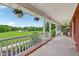 Inviting covered porch featuring hanging flower baskets and swing at 3564 Clear Creek Blvd, Martinsville, IN 46151