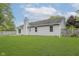 Exterior view of the backyard with lush green grass and mature trees at 374 Pomona Ct, Greenfield, IN 46140